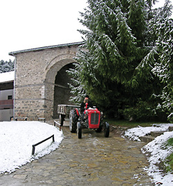 Duties: a monk of Dečani on a tractor